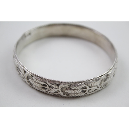 343 - Silver antique high relief bangle (69g)