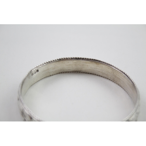 343 - Silver antique high relief bangle (69g)