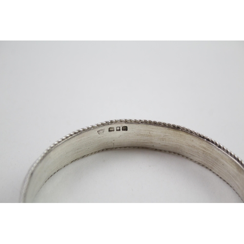 343 - Silver antique high relief bangle (69g)