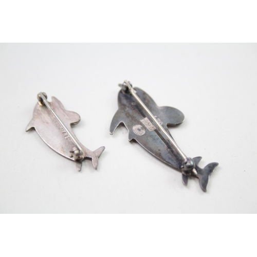 360 - Two silver dolphin brooches by Georg Jensen (8g)