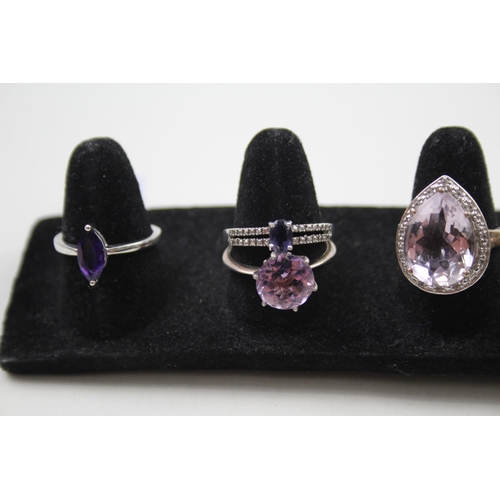 365 - A collection of silver Amethyst rings including TGGC (23g)