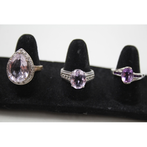 365 - A collection of silver Amethyst rings including TGGC (23g)