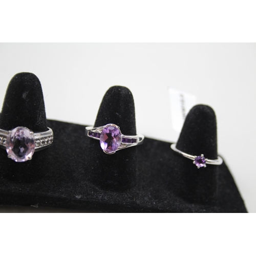 365 - A collection of silver Amethyst rings including TGGC (23g)