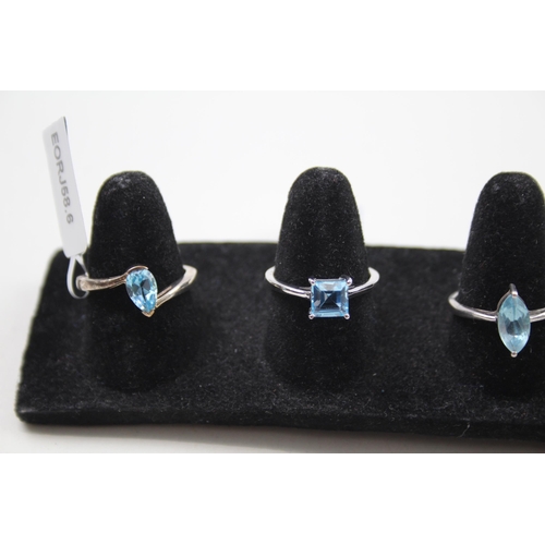 369 - A collection of silver gemstone rings including Blue Topaz (15g)