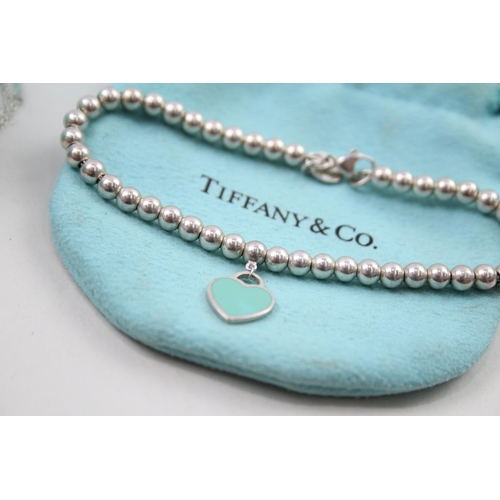 384 - A collection of silver jewellery by designer Tiffany & Co (8g)