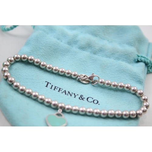 384 - A collection of silver jewellery by designer Tiffany & Co (8g)