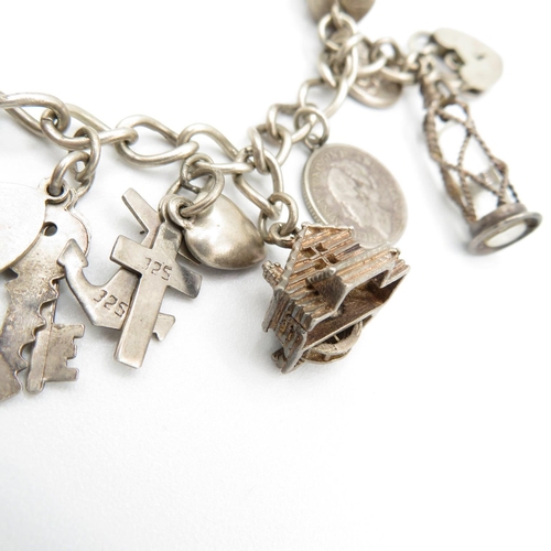 366 - HM silver charm bracelet  with assorted charms, some articulated  40.5g