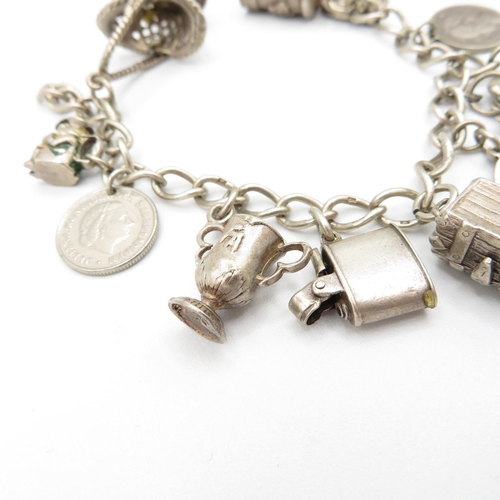 366 - HM silver charm bracelet  with assorted charms, some articulated  40.5g