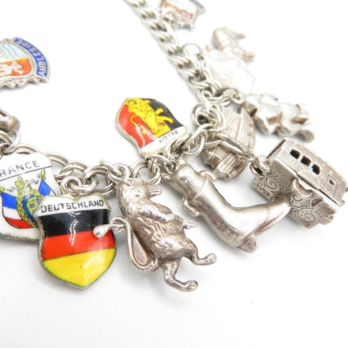 367 - HM silver charm bracelet  with assorted charms, some articulated  40.3g