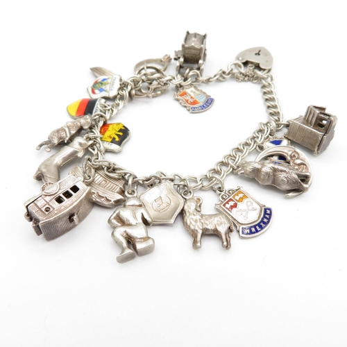 367 - HM silver charm bracelet  with assorted charms, some articulated  40.3g