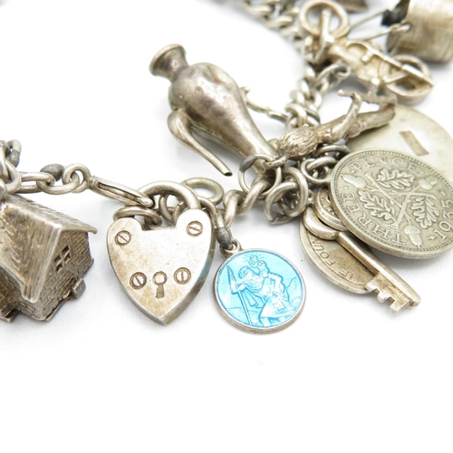 390 - HM silver charm bracelet with assorted charms, some articulated  63.5g