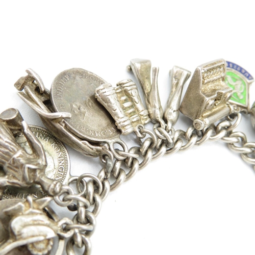 390 - HM silver charm bracelet with assorted charms, some articulated  63.5g