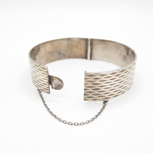 393 - HM silver bangle with safety chain  43.2g