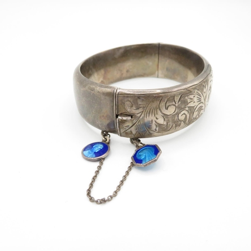 398 - HM silver bangle with enamelled blue charms and safety chain  28.8g