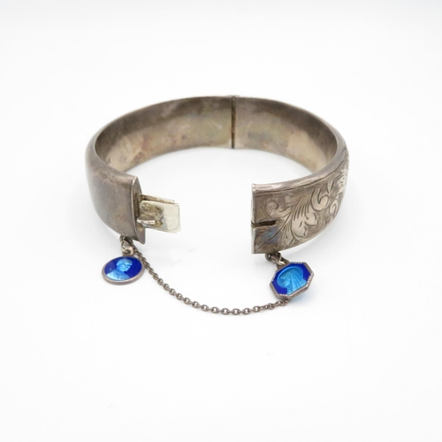 398 - HM silver bangle with enamelled blue charms and safety chain  28.8g