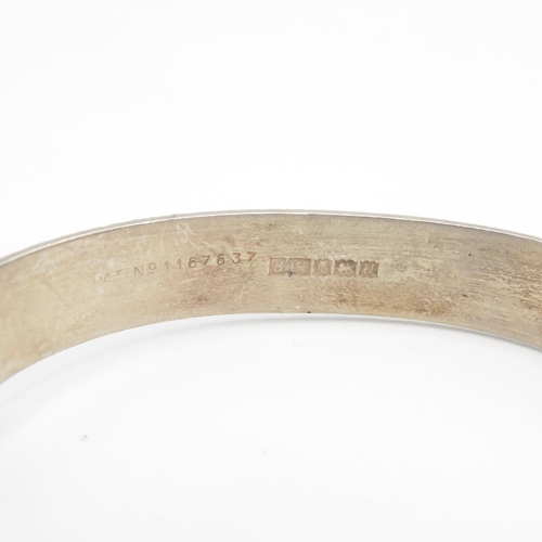 405 - HM silver bangle with safety chain and bark effect finish  20.8g