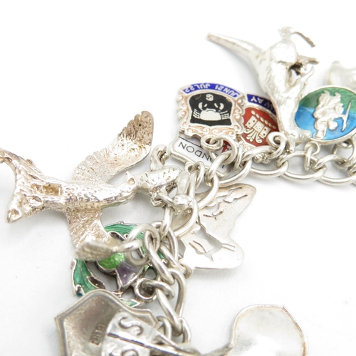 411 - HM silver charm bracelet with assorted charms, some articulated  60.8g