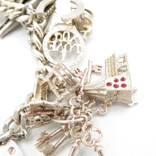 419 - HM silver charm bracelet with assorted charms, some articulated   75.1g