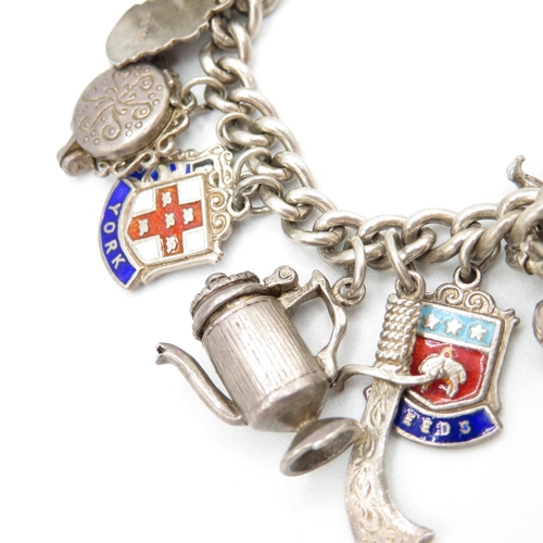 428 - HM silver charm bracelet with assorted charms including place names  52.8g