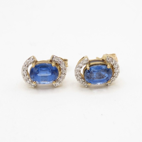 131 - 9ct gold diamond and sapphire stud earrings (2.1g)