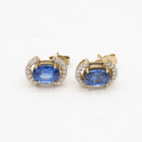 131 - 9ct gold diamond and sapphire stud earrings (2.1g)