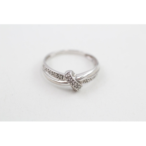 115 - 9ct white gold diamond knot ring with split shank 1.6g Size O 1/2