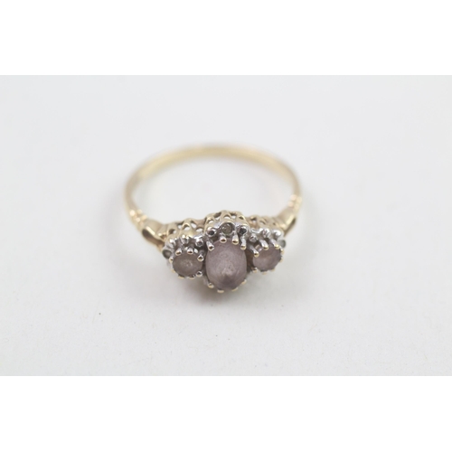 119 - 9ct gold amethyst three stone ring with diamond surround 1.7g Size M 1/2