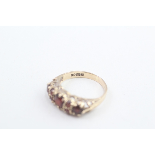 133 - 9ct gold vintage garnet seven stone ring 2.1g Size K