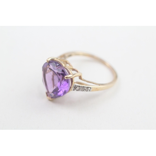 140 - 9ct gold amethyst heart ring with white gemstone set shoulders 3.3g Size N 1/2