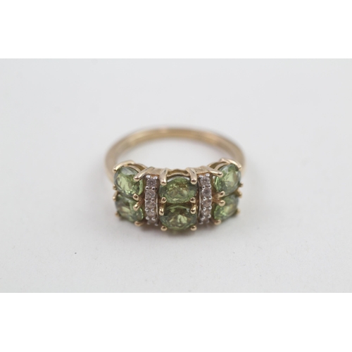 168 - 9ct gold peridot & white gemstone dress ring 3.1g Size M