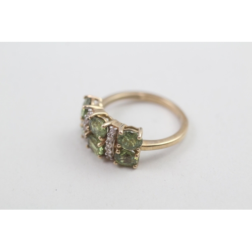 168 - 9ct gold peridot & white gemstone dress ring 3.1g Size M