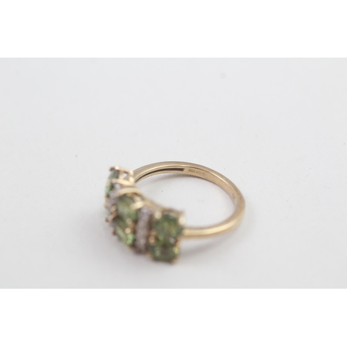 168 - 9ct gold peridot & white gemstone dress ring 3.1g Size M