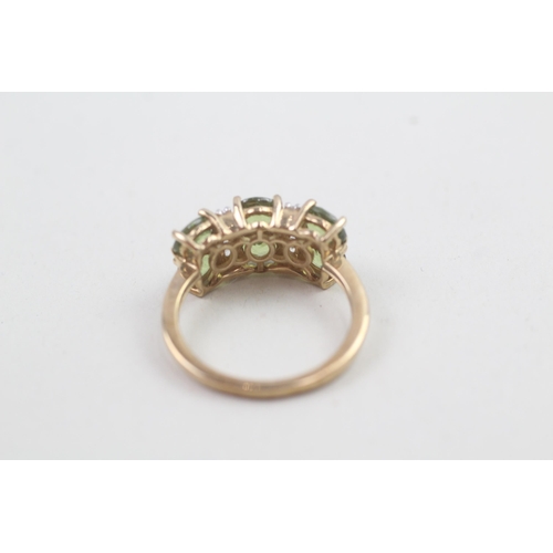 168 - 9ct gold peridot & white gemstone dress ring 3.1g Size M