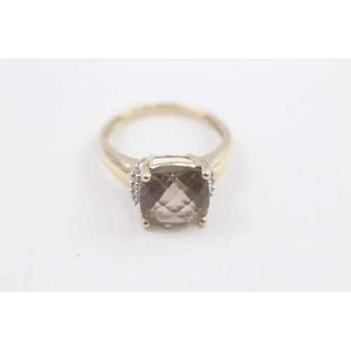 173 - 9ct gold checkerboard smoky quartz single stone ring with diamond sides 3.2g Size P