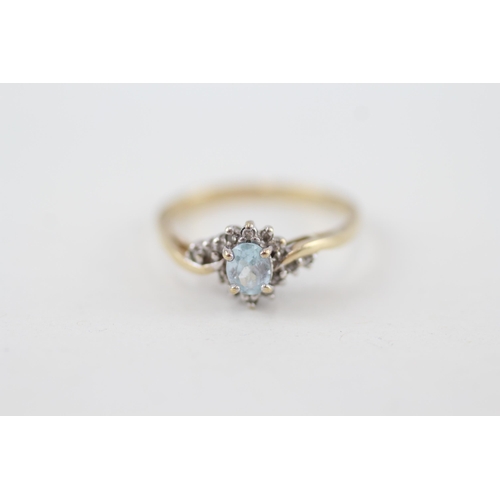 20 - 9ct gold oval cut blue topaz & diamond dress ring 1.9g Size P