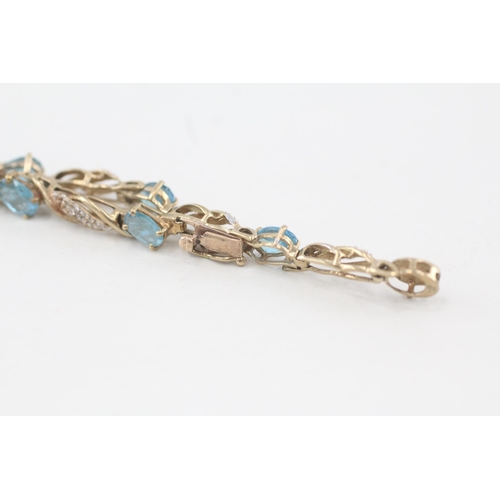 214 - 9ct gold diamond & topaz fancy link bracelet 7.8g