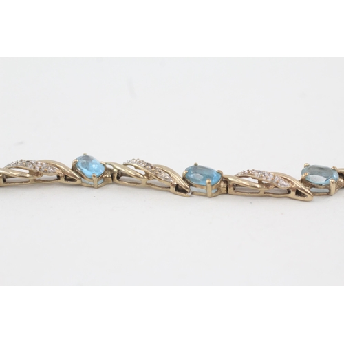 214 - 9ct gold diamond & topaz fancy link bracelet 7.8g