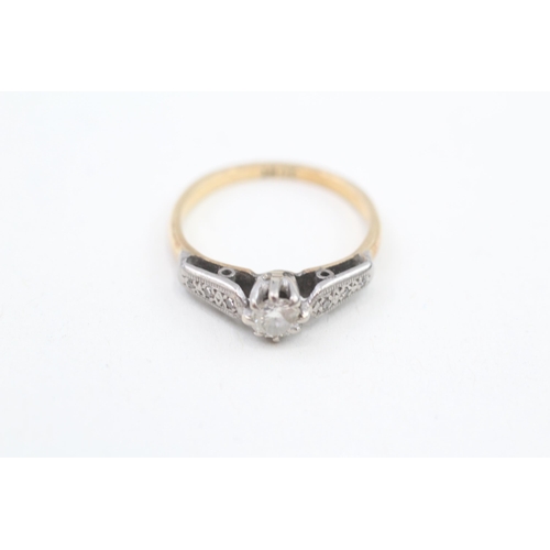 219 - 18ct gold round brilliant diamond single stone ring with diamond set shoulders 2.4g Size L