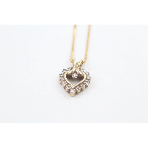 223 - 9ct gold diamond heart shaped pendant necklace, claw set 3g