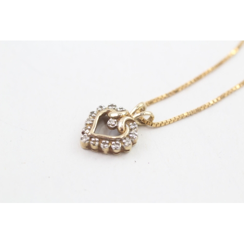 223 - 9ct gold diamond heart shaped pendant necklace, claw set 3g