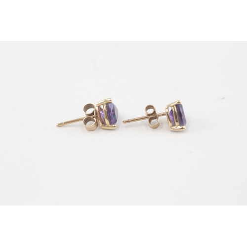 229 - 9ct gold trillion amethyst stud earrings with scroll backs 1g