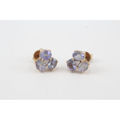 235 - 9ct gold tanzanite & diamond stud earrings with scroll backs 2.1g