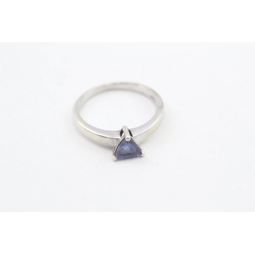 239 - 9ct gold trillion cut tanzanite solitaire ring, claw set 3g Size O