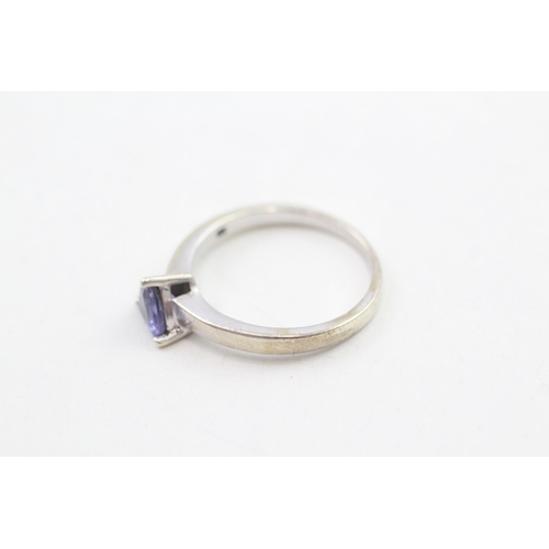 239 - 9ct gold trillion cut tanzanite solitaire ring, claw set 3g Size O