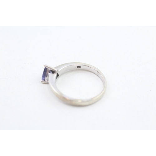 239 - 9ct gold trillion cut tanzanite solitaire ring, claw set 3g Size O