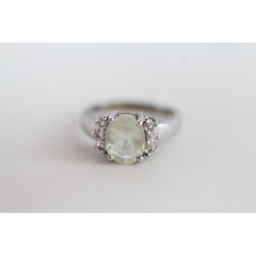 243 - 9ct gold green & white gemstone ring 3.5g Size N 1/2