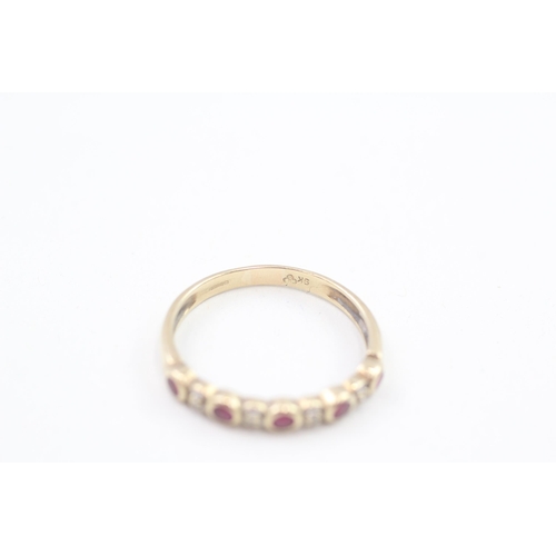 244 - 9ct gold diamond & ruby nine stone ring 1.7g Size Q