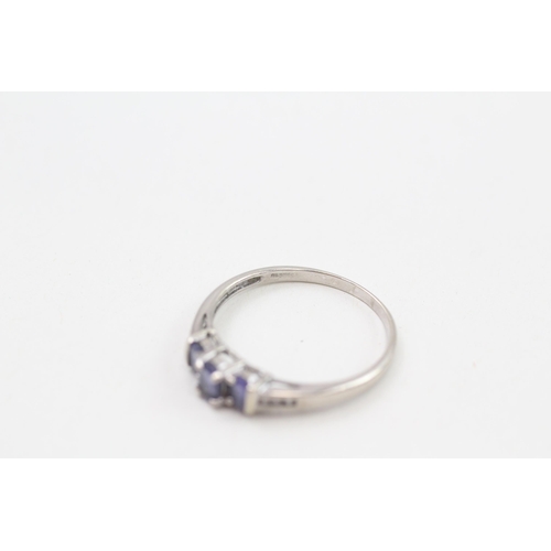 254 - 9ct white gold tanzanite three stone ring with diamond set shoulders 1.8g Size R