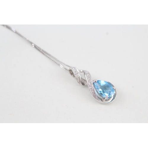 270 - 9ct gold blue topaz & diamond pendant necklace 2.4g