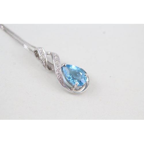 270 - 9ct gold blue topaz & diamond pendant necklace 2.4g